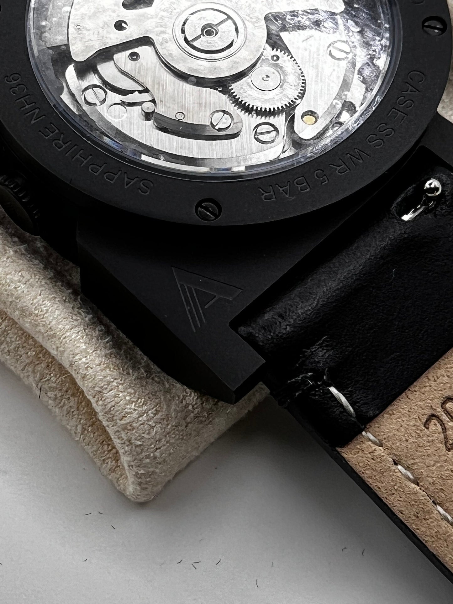 Black and white NH38 powered watch in Ando case