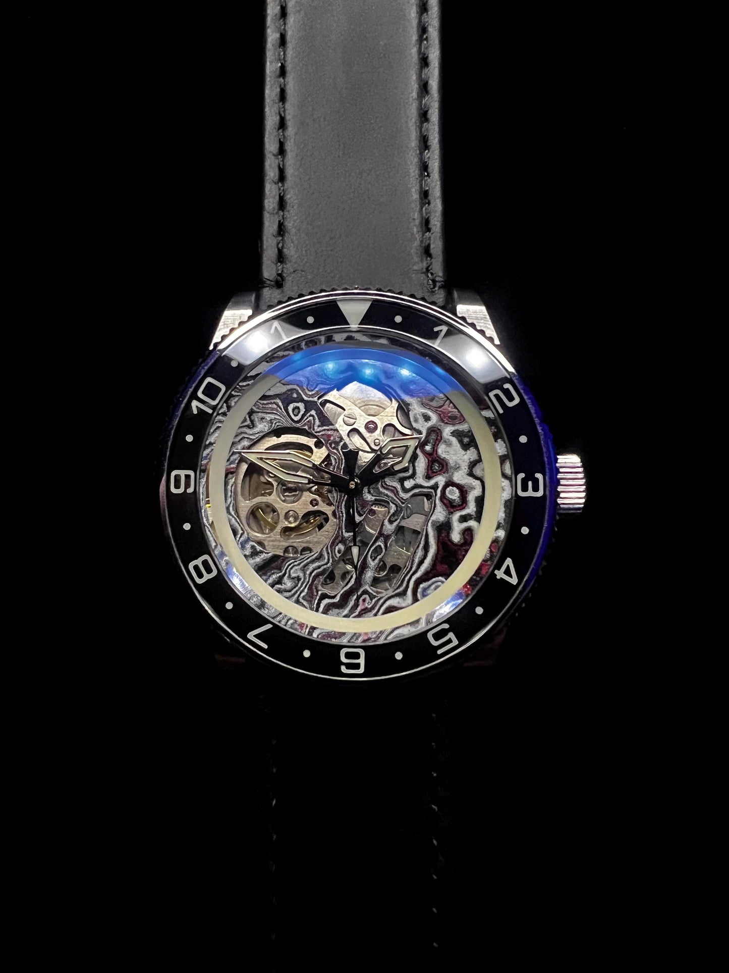 Watch with Skeletonized fordite dial (NH70 powered)
